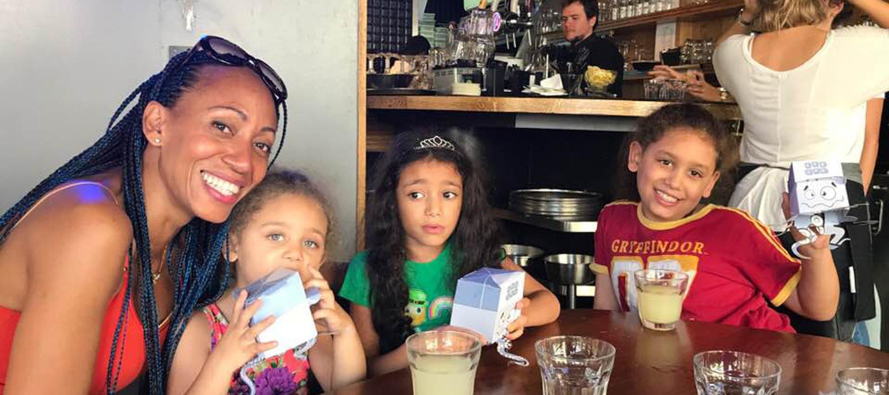 the yurista family at a restaurant smiling