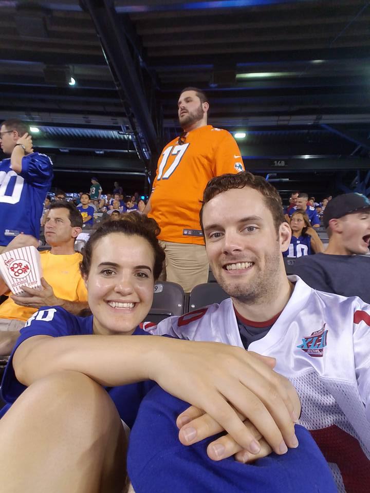 Alex with his wife at a baseball game before coming to class says he has learned more at our mma gym in westwood than his previous one