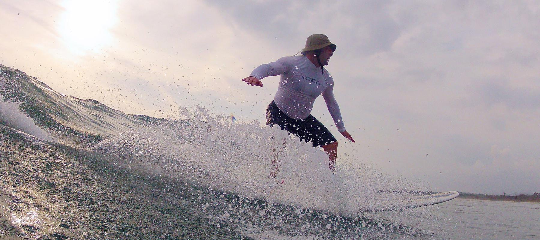 physician paul gaglio surfing in the ocean before he trains mma for self defense in westwood nj